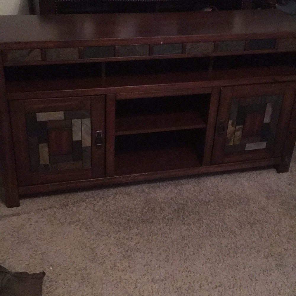 Brown TV Stand 65” couple chips on the side.